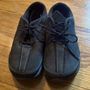 Altra black suede sneakers with wide toe box.